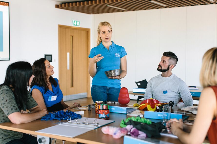 Battersea staff member talking to a group of people