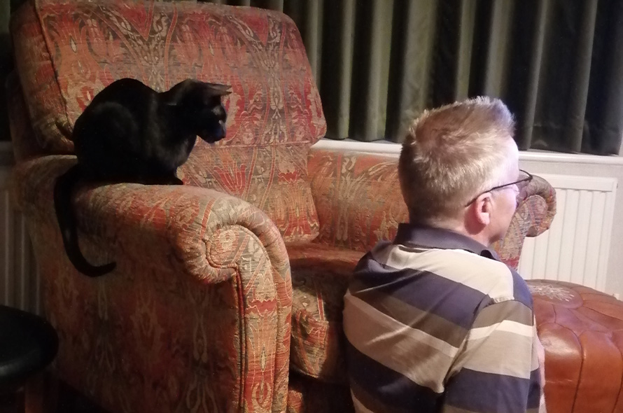 Noggin and his foster carer watching TV